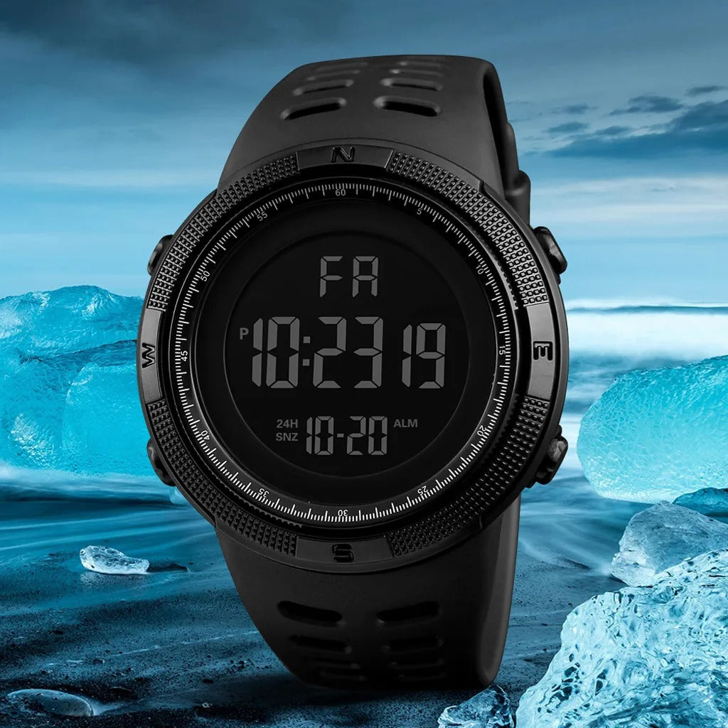 Tactical digital sports watch displayed on a blue background with the sea in view, highlighting its rugged design and multifunction display.