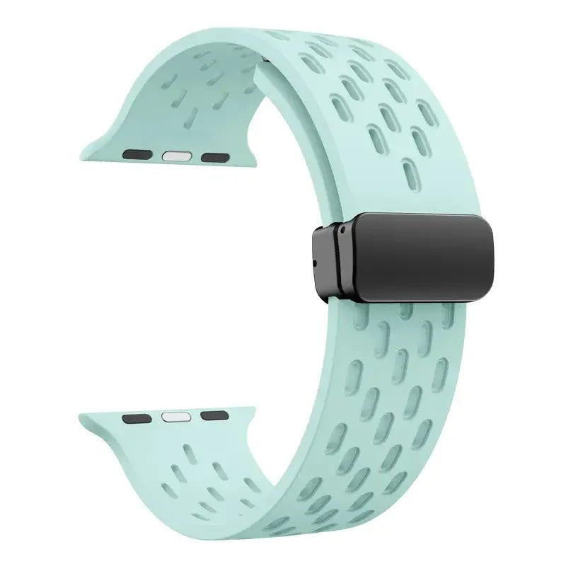 Mint green perforated rubber sport strap for Apple Watch with black clasp, compatible with all Apple Watch sizes