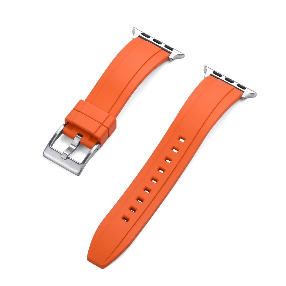 Close-up of an orange rubber Apple Watch strap with a silver buckle and adapter, shown detached into two pieces on a white background.