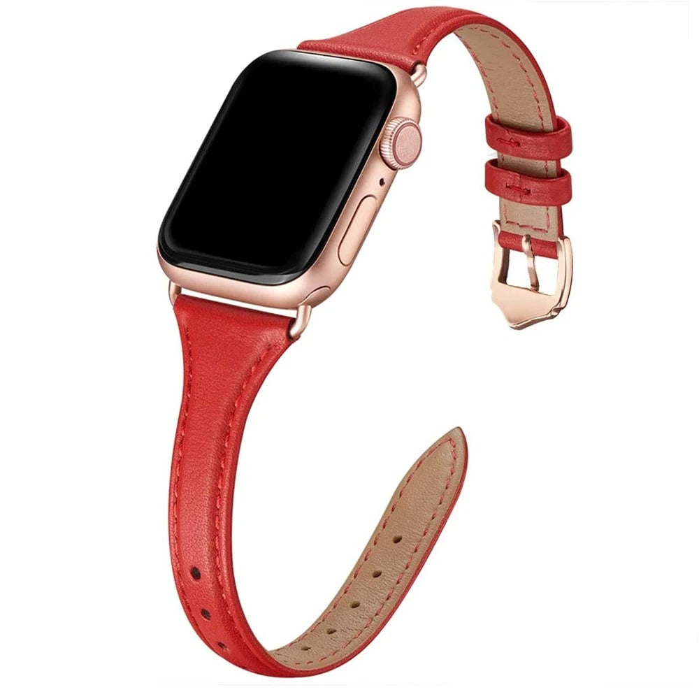 Slim red leather Apple Watch strap with rose gold hardware and classic pin buckle.