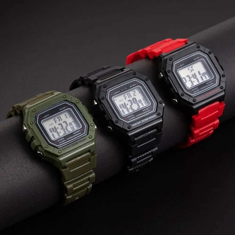 Watches in olive green, black and red colors with rectangular display, showing time, date, and alarm status.