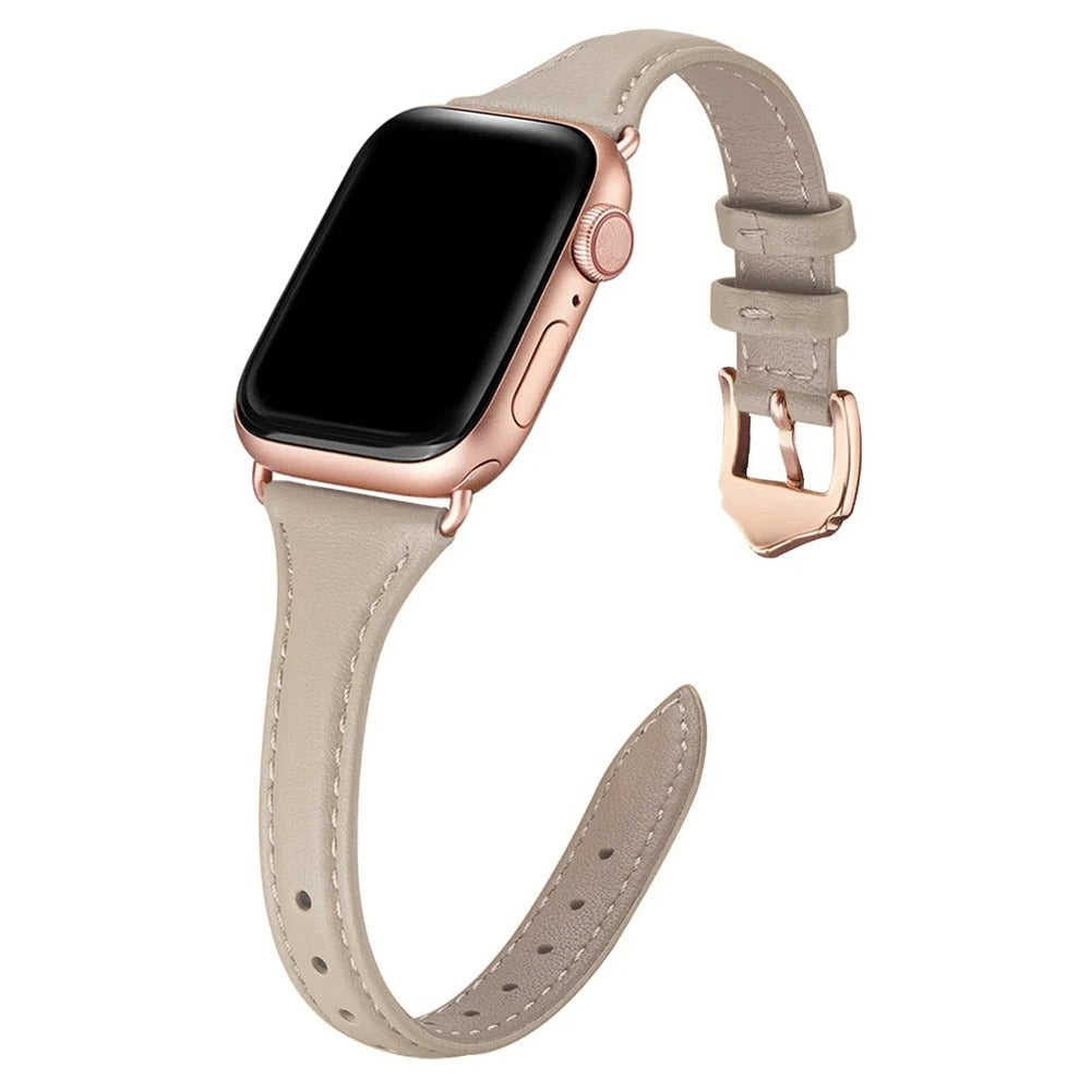Slim beige leather Apple Watch strap with rose gold hardware and classic pin buckle.