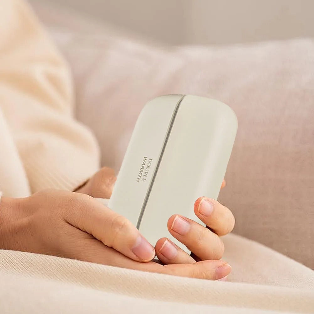 Beige 2-in-1 magnetic rechargeable hand warmers with ergonomic design, captured in hands to show their size, compact and portable electric pocket heater ideal for outdoor use and tech gifting. 