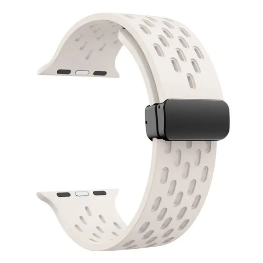 Beige perforated rubber sport strap for Apple Watch with black clasp, compatible with all Apple Watch sizes