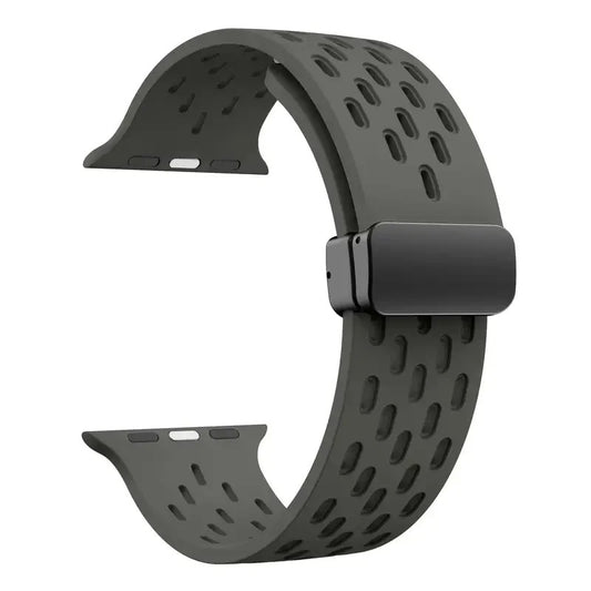 Dark gray perforated rubber sport strap for Apple Watch with black clasp, compatible with all Apple Watch sizes