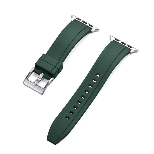 Close-up of a green rubber Apple Watch strap with a silver buckle and adapter, shown detached into two pieces on a white background.