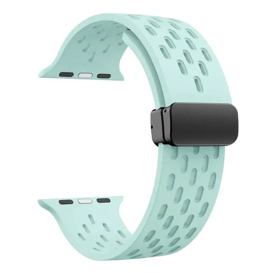Mint green perforated rubber sport strap for Apple Watch with black clasp, compatible with all Apple Watch sizes