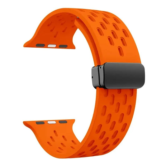 Orange perforated rubber sport strap for Apple Watch with black clasp, compatible with all Apple Watch sizes