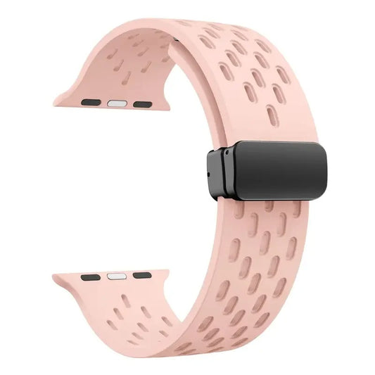 Pink perforated rubber sport strap for Apple Watch with black clasp, compatible with all Apple Watch sizes