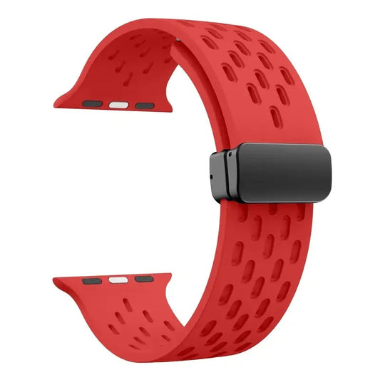 Red perforated rubber sport strap for Apple Watch with black clasp, compatible with all Apple Watch sizes