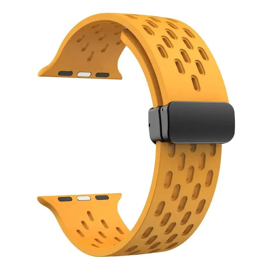 Yellow perforated rubber sport strap for Apple Watch with black clasp, compatible with all Apple Watch sizes